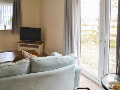 Televiisor ja/või meelelahutuskeskus majutusasutuses Maisie's Cottage