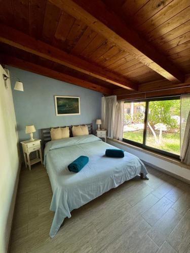 a bedroom with a bed and a large window at Villa Giulia in Parghelia