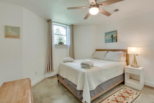 a bedroom with a bed and a ceiling fan at Bright Oasis on Lake Hartwell with Boat Dock! in Anderson