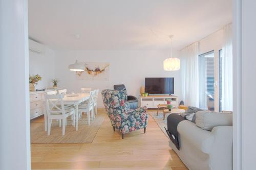 a living room with a couch and a table at Benfica Prime Terrace II by Homing in Lisbon