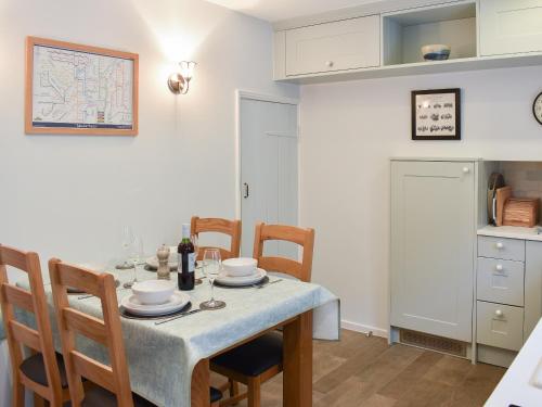 a kitchen and dining room with a table and chairs at Hovera in Glenridding