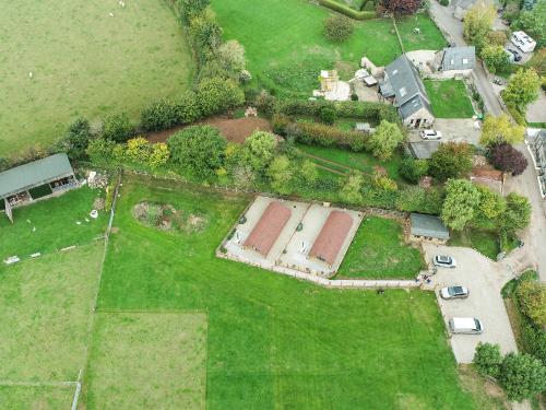 an aerial view of a house with a yard at Glamping Pod 2 in Ipplepen