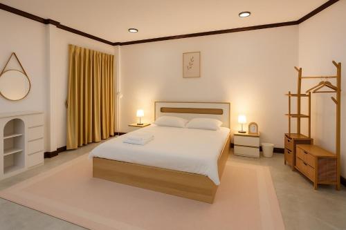 Ένα ή περισσότερα κρεβάτια σε δωμάτιο στο Jaiko home&Hotel