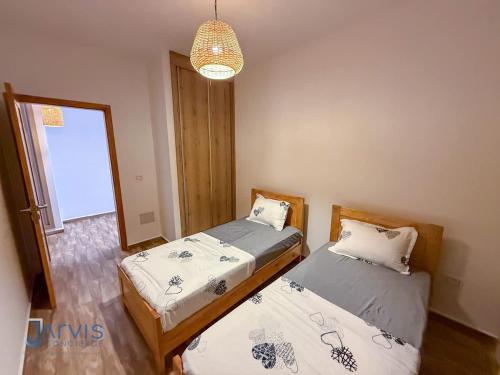 Кровать или кровати в номере Villa avec terrasse S2 piscine jardin Rafraf