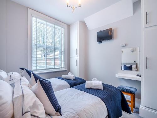 Ένα ή περισσότερα κρεβάτια σε δωμάτιο στο The Landings Apartment 6