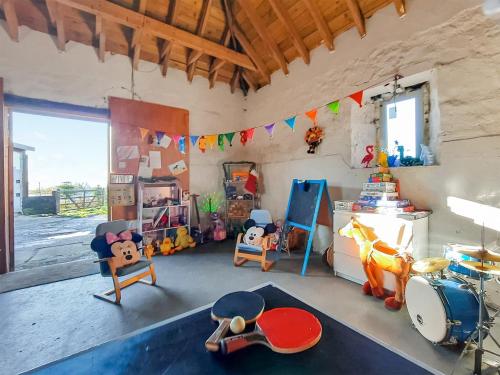 a room with a drum set and toys in it at Cow Boy Cabin - Uk47145 in Glasgow