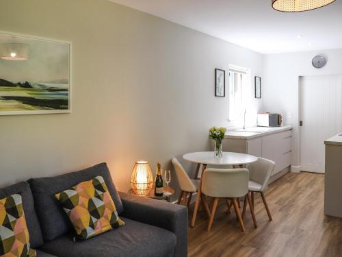 a living room with a couch and a table at Dinas Lodge - Uk47607 in Caernarfon