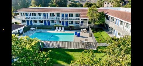 an aerial view of a house with a swimming pool at Studio 6 San Luis Obispo, CA South in San Luis Obispo