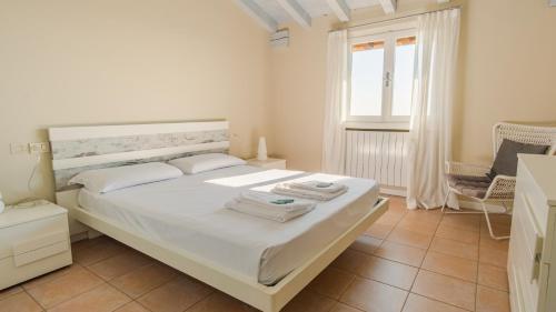 Ένα ή περισσότερα κρεβάτια σε δωμάτιο στο Villa Giulia - Italian Homing