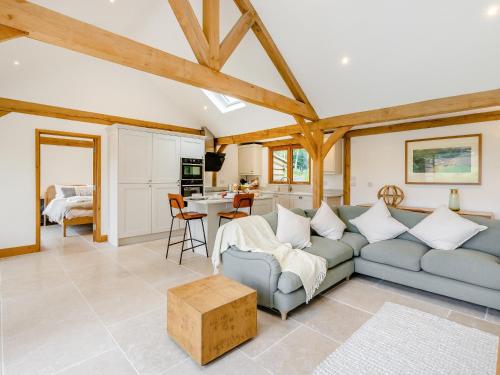 a living room with a couch and a table at Loxford Lodge - Uk47304 in Uttoxeter