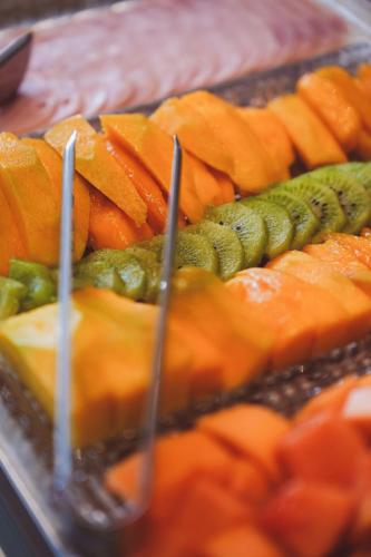 a tray of different types of fruits and vegetables at Casa Yogui Brasil in Garopaba