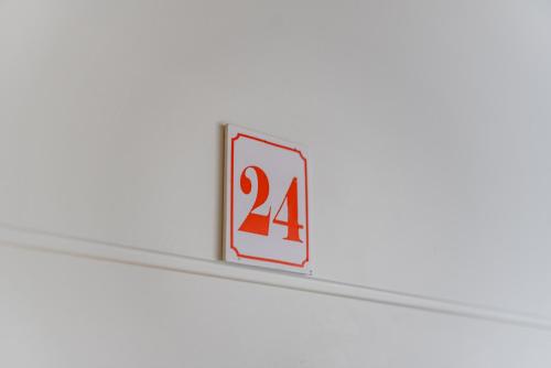a sign with the number on a shelf at Olivia's Apartments in Velipojë