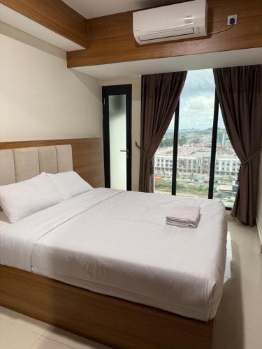 Katil atau katil-katil dalam bilik di Pollux Habibie Superior By Superstay