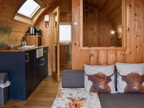 a bedroom with a bed with cow pillows on it at Withy Bottom-Uk1393 in Corney
