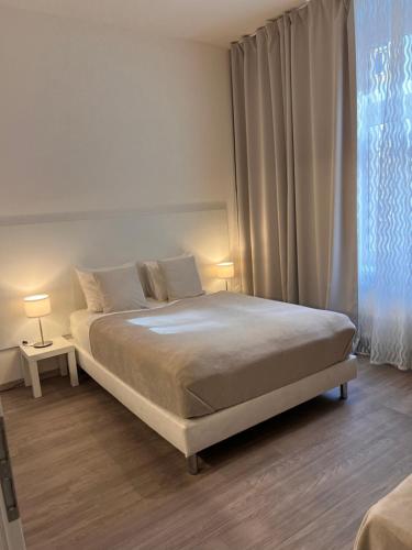 Maria Apartment Libenにあるベッド