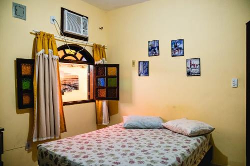 Ένα ή περισσότερα κρεβάτια σε δωμάτιο στο Casa das Dunas