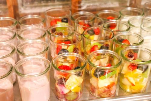 a group of jars filled with fruit and vegetables at Hotel Goldenes Fass in Rothenburg ob der Tauber in Rothenburg ob der Tauber