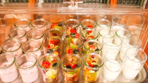 a group of clear cups filled with different types of fruit at Hotel Goldenes Fass in Rothenburg ob der Tauber in Rothenburg ob der Tauber