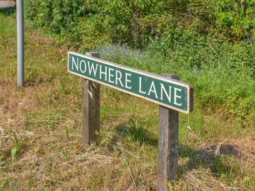 a street sign for nohere lane in a field at No 2 Badger Sett-Uk44307 in Lenwade