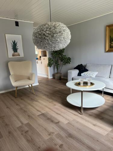 a living room with a couch and a table at Lugna Villan 4 in Köpingsvik