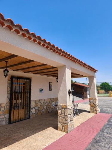 a front door of a building with a gate at Finca La Ecarada. Férez (Albacete) in Férez