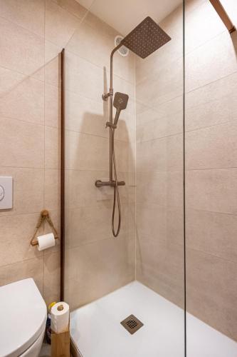 a shower with a glass door in a bathroom at Casa Sana sur le port in Sanary-sur-Mer