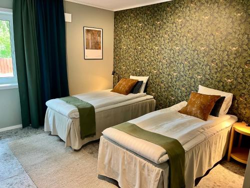 Postel nebo postele na pokoji v ubytování Vätterleden Hotell & Restaurang