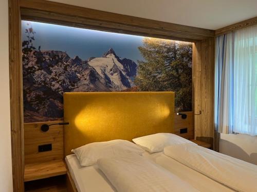 Postel nebo postele na pokoji v ubytování Hotel - Restaurant - Sonnblick