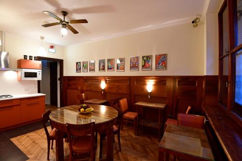 a kitchen and dining room with a table and chairs at Hostel Deco in Krakow