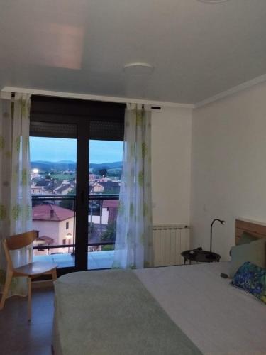 Postel nebo postele na pokoji v ubytování Quiet apartment in Cudón