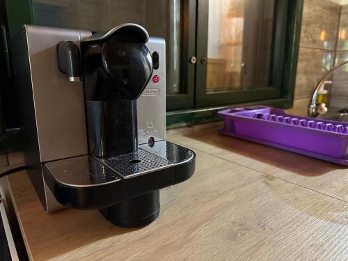 a coffee maker sitting on top of a counter at Faház - Nyaraló a Tiszánál in Tiszacsege
