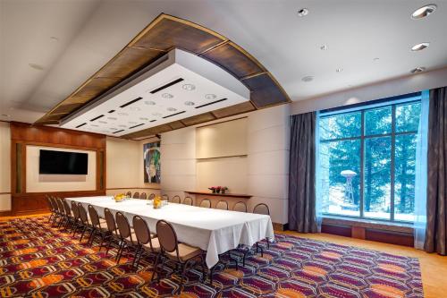 a conference room with a table and chairs at Hilton Lac-Leamy in Gatineau