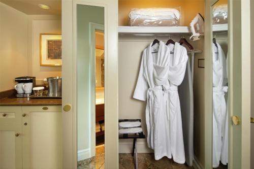 two pictures of a closet with a robe on a door at Hilton Lac-Leamy in Gatineau