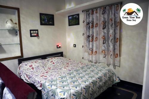 Cama o camas de una habitación en Green View Nest Home Stay