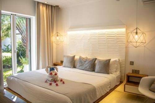 a bedroom with a bed with stars on it at Comfortable villa with private pool in Grand-Baie