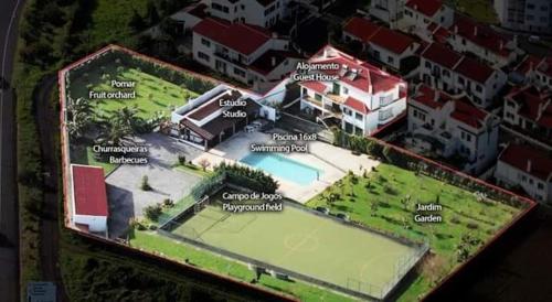 a rendering of a building with a tennis court at Casa Barão das Laranjeiras in Ponta Delgada