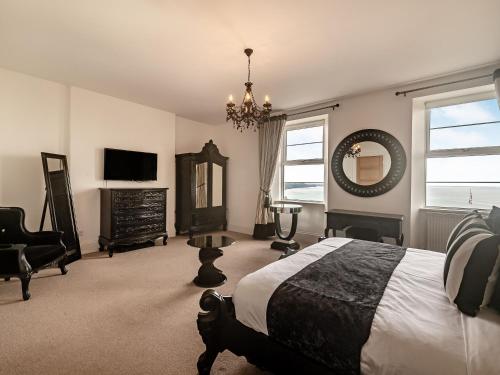 Ένα ή περισσότερα κρεβάτια σε δωμάτιο στο Babbacombe House