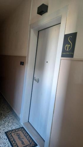 a glass door in a room with a sign on the wall at ST Luxury Urban Living in Serres
