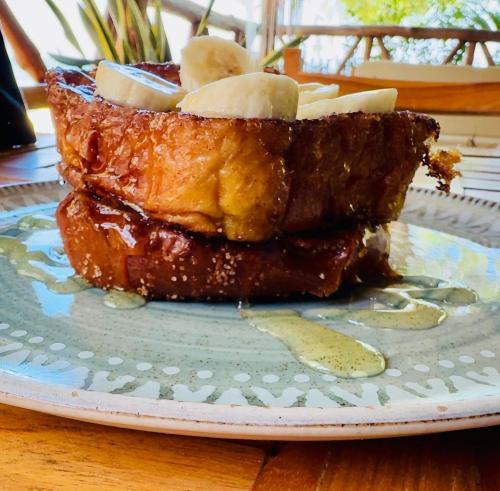 a piece of food on a plate on a table at Thani Ecobeach Barú in Playa Blanca