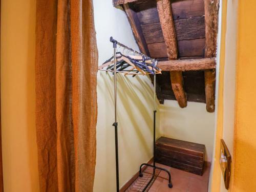 a room with a curtain and a pole in a room at Tuscan Farmhouse in the Countryside in Serravalle Pistoiese