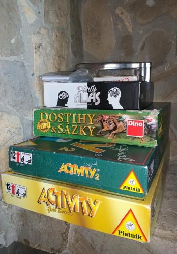 a stack of books stacked on top of each other at Penzion pod Brehom in Terchová
