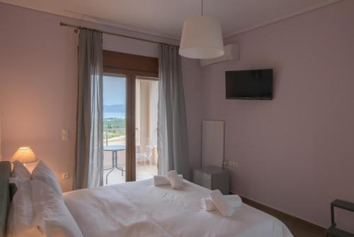 Posteľ alebo postele v izbe v ubytovaní Petra Luxury Rooms and Apartments
