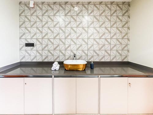 a bathroom with a bowl sink on a counter at 5 Star Luxe 2BHK River View Apartment Porvorim in Porvorim