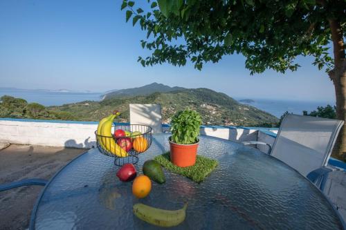 a table with a bunch of fruits and vegetables on it at Blue Horizon in Skopelos Town
