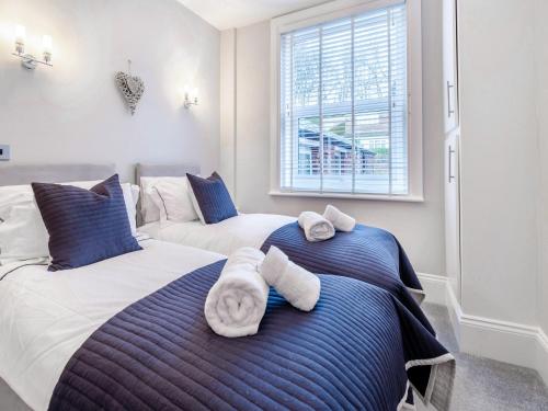 Ένα ή περισσότερα κρεβάτια σε δωμάτιο στο The Landings Apartment 6