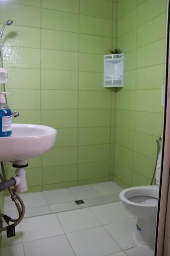 a bathroom with a sink and a toilet at Dar margoum in Marrakech