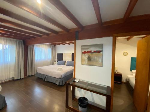 Postel nebo postele na pokoji v ubytování Hotel Lagoluz