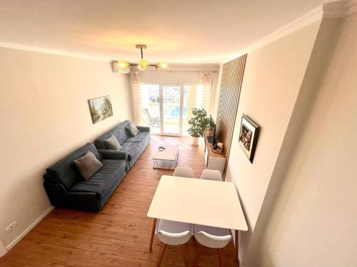 a living room with a couch and a table at Vista Adriatic Cz By Adriatic Living in Durrës