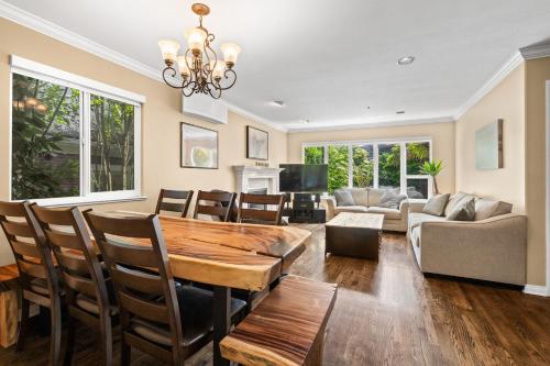 a living room with a table and chairs and a couch at Luxury Retreat in Vancouver in Vancouver