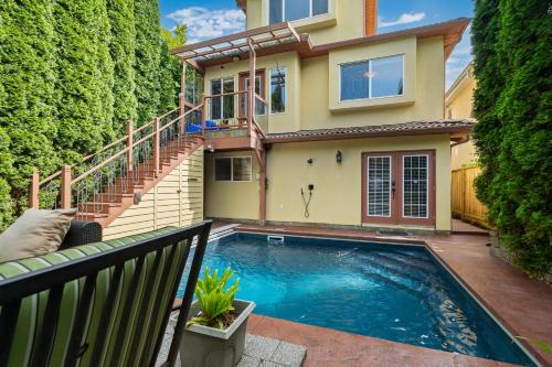 a swimming pool in front of a house at Luxury Retreat in Vancouver in Vancouver